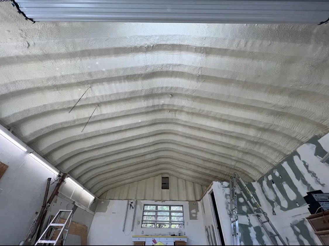 Spray polyurethane foam applied to the underside of a metal roof deck in Portage Lakes